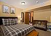 Queen bed and two sets of twin bunks