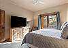 King bed, walk-in closet, ensuite bathroom with dual sinks and shower