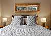 King bed, walk-in closet, ensuite bathroom with dual sinks and shower