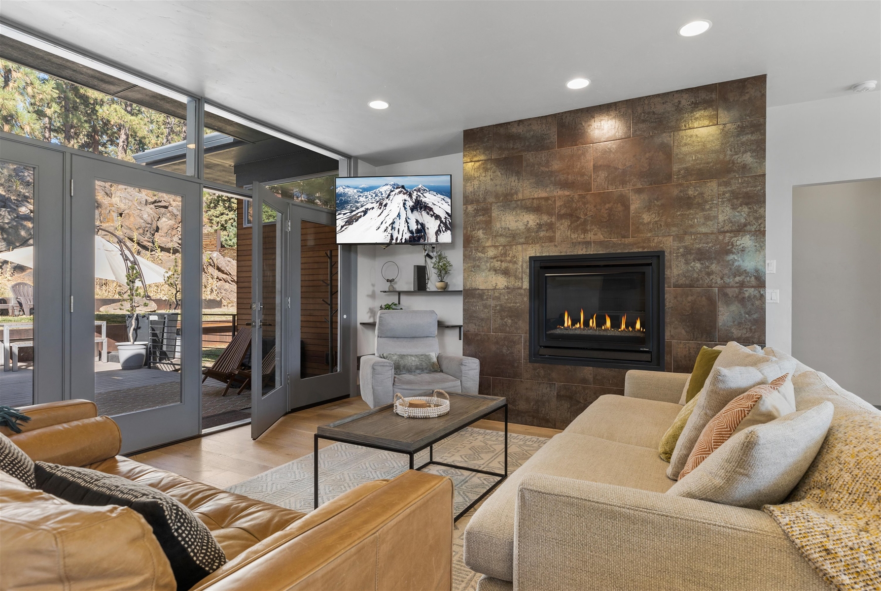 Cozy up in style! This living room is perfect for relaxation and gathering, with direct views of the backyard.
