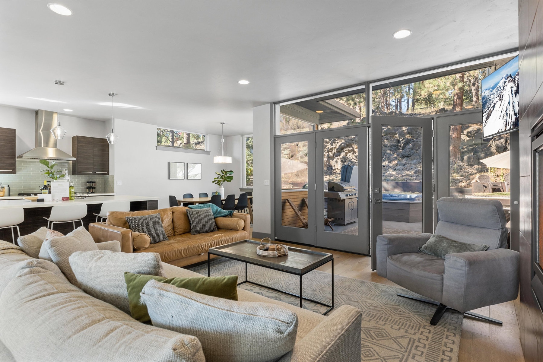 Cozy up in style! This living room is perfect for relaxation and gathering, with direct views of the backyard.
