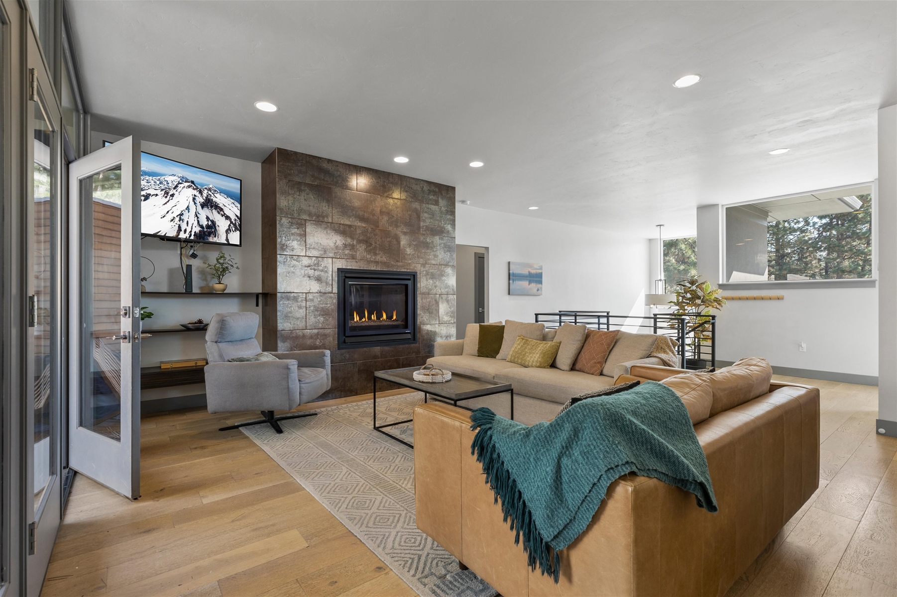 Cozy up in style! This living room is perfect for relaxation and gathering, with direct views of the backyard.
