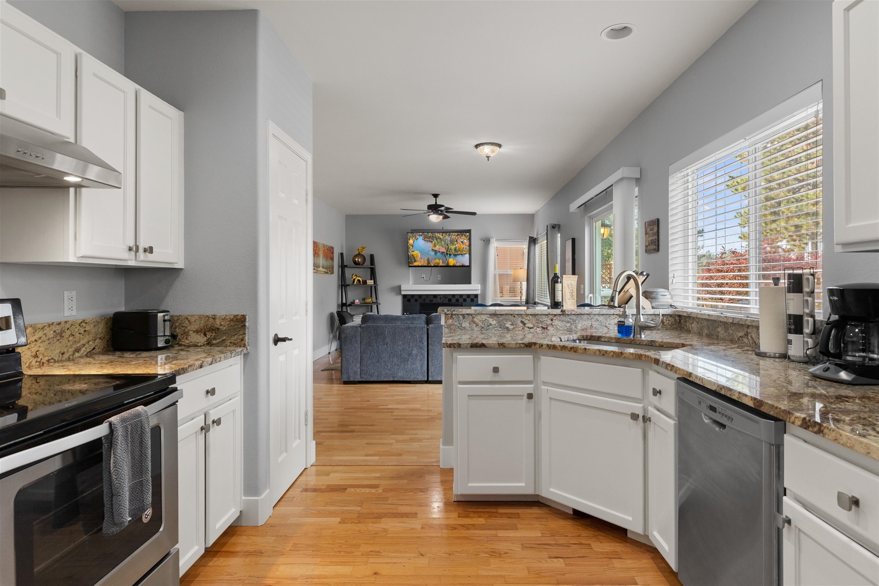 Open kitchen with views of deck and yard. 