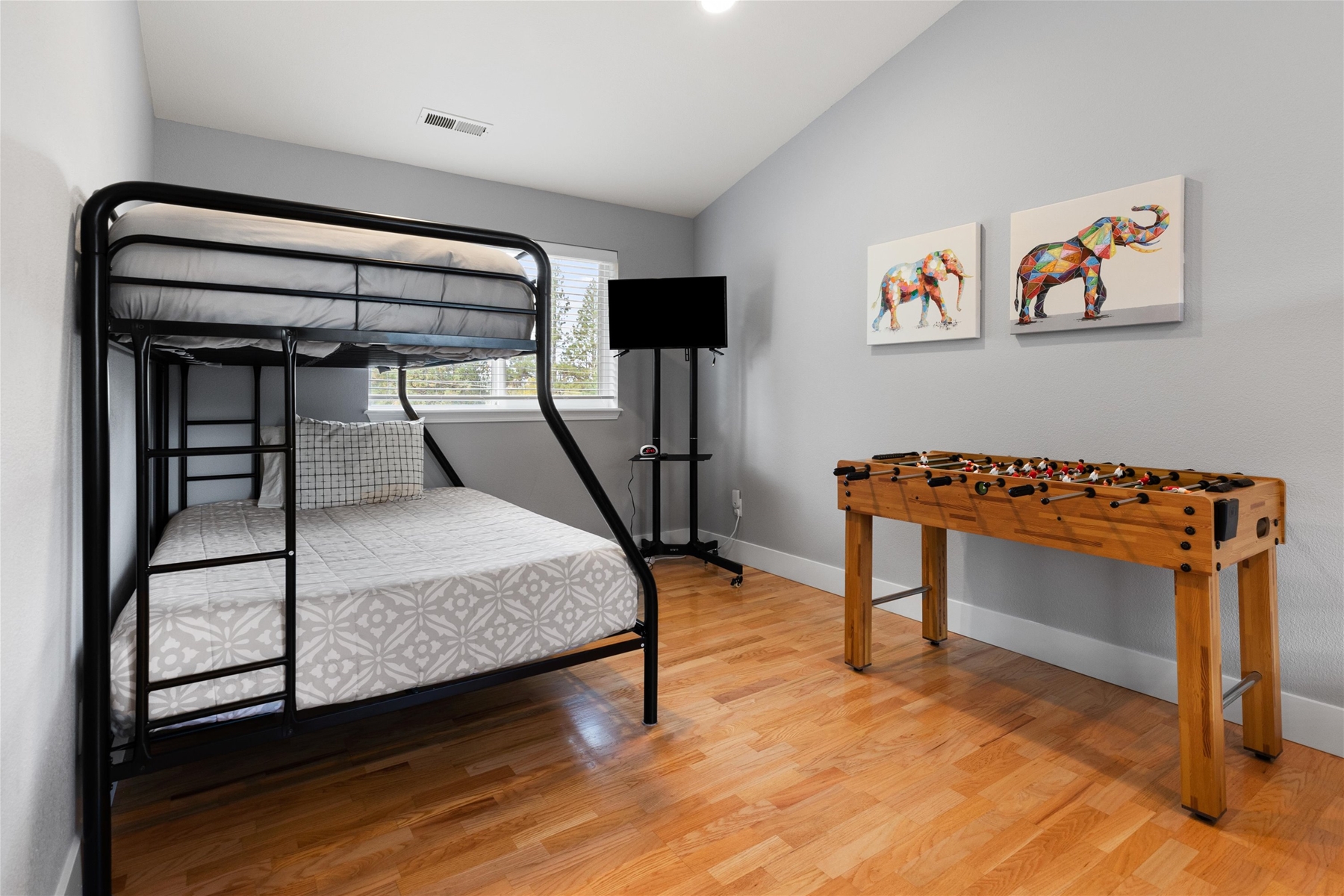 Bunk room with two full/twin bunk beds – includes foosball, flat screen TV, and HDMI hookup for gaming. 