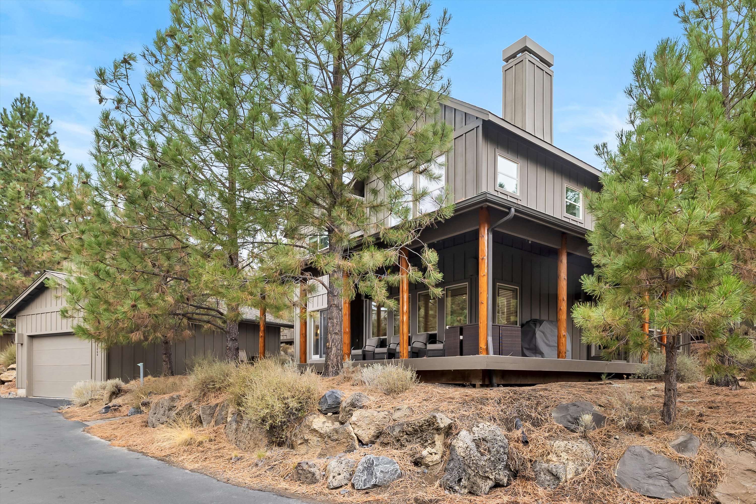 Modern exterior of Rafters Court surrounded by pines — River Wild, Mt. Bachelor Village Resort, Bend OR.