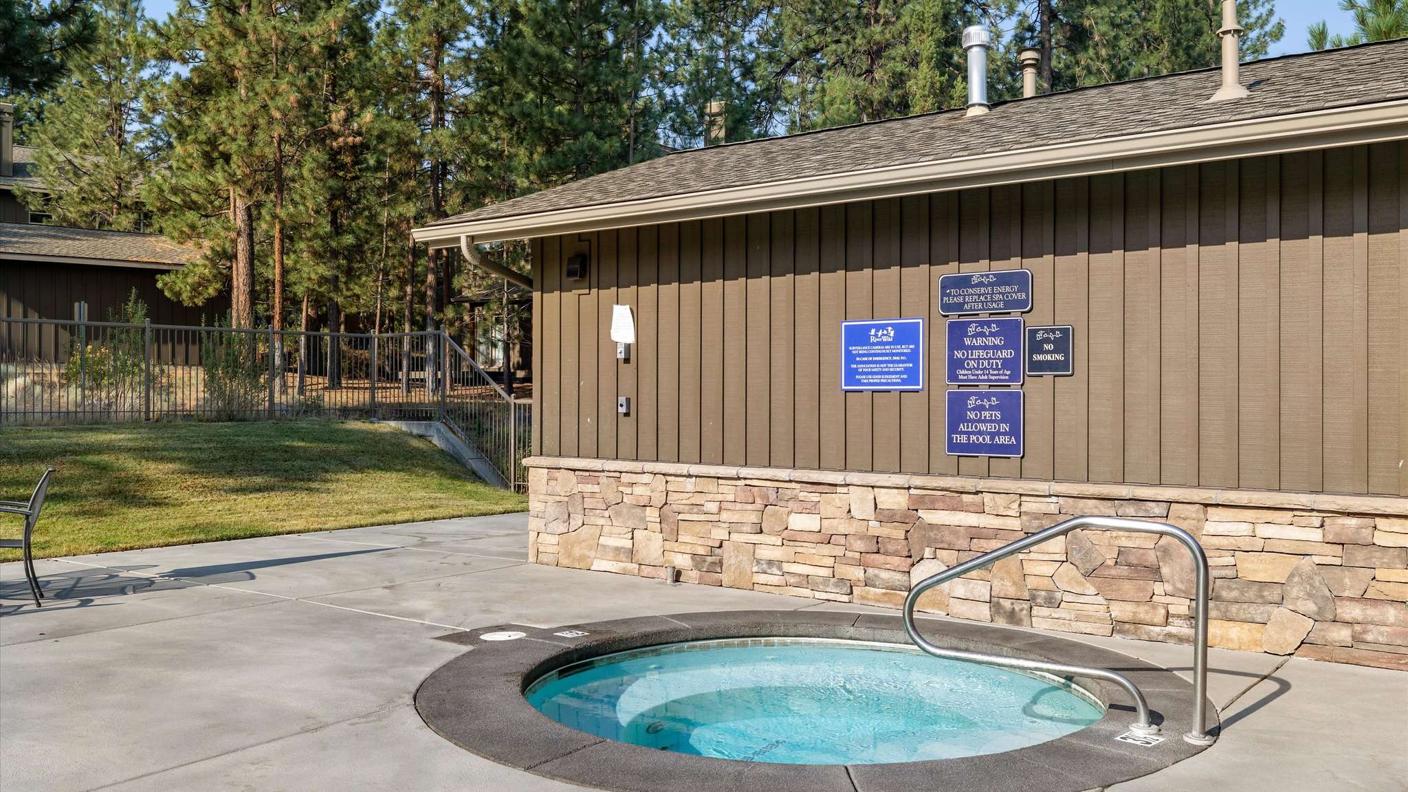 Year-round community hot tub at River Wild — steps from Rafters Court vacation rental, Bend OR.