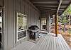 Natural gas grill on the private covered deck — Rafters Court, River Wild vacation rental, Bend OR.