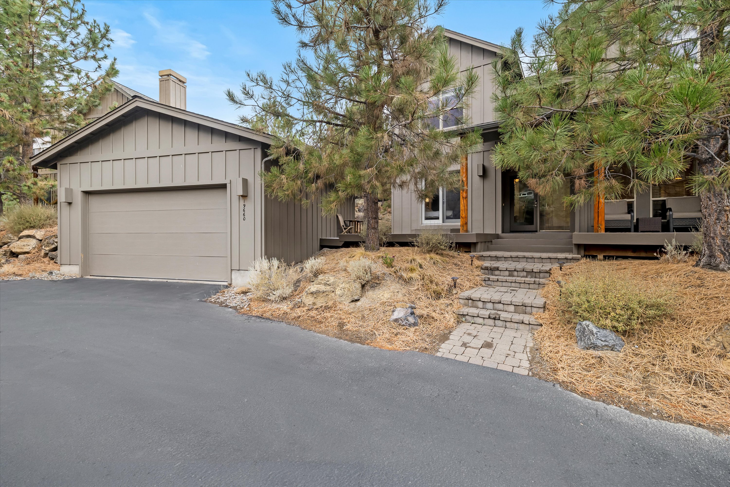 Exterior of Rafters Court vacation rental with attached garage — River Wild, Mt. Bachelor Village Resort, Bend OR.