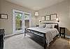 King main suite with private French door deck access.