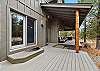 Wrap-around deck with outdoor dining and natural gas grill — Rafters Court, River Wild, Bend OR.