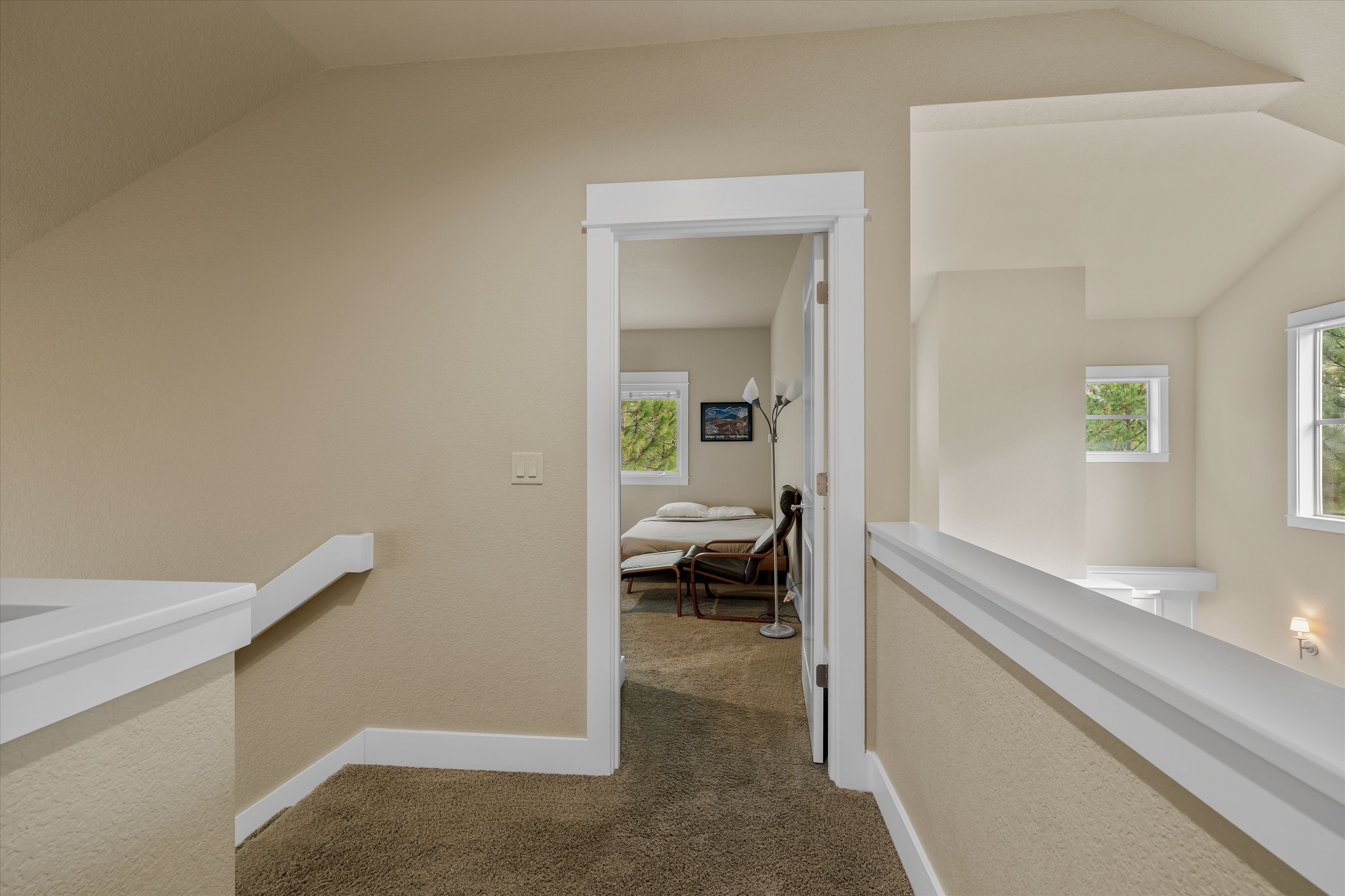 Upper level hallway leading to guest bedrooms.
