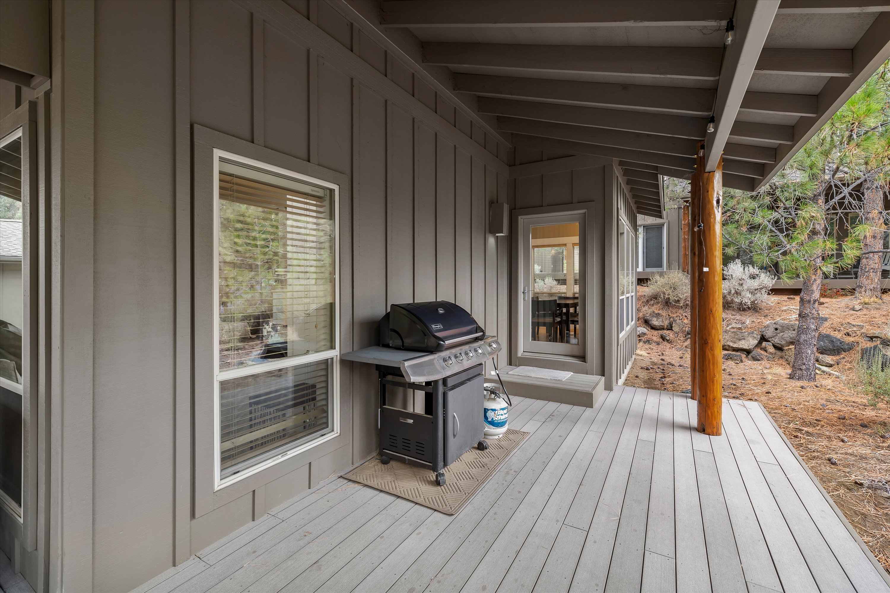 Natural gas grill on the private covered deck — Rafters Court, River Wild vacation rental, Bend OR.