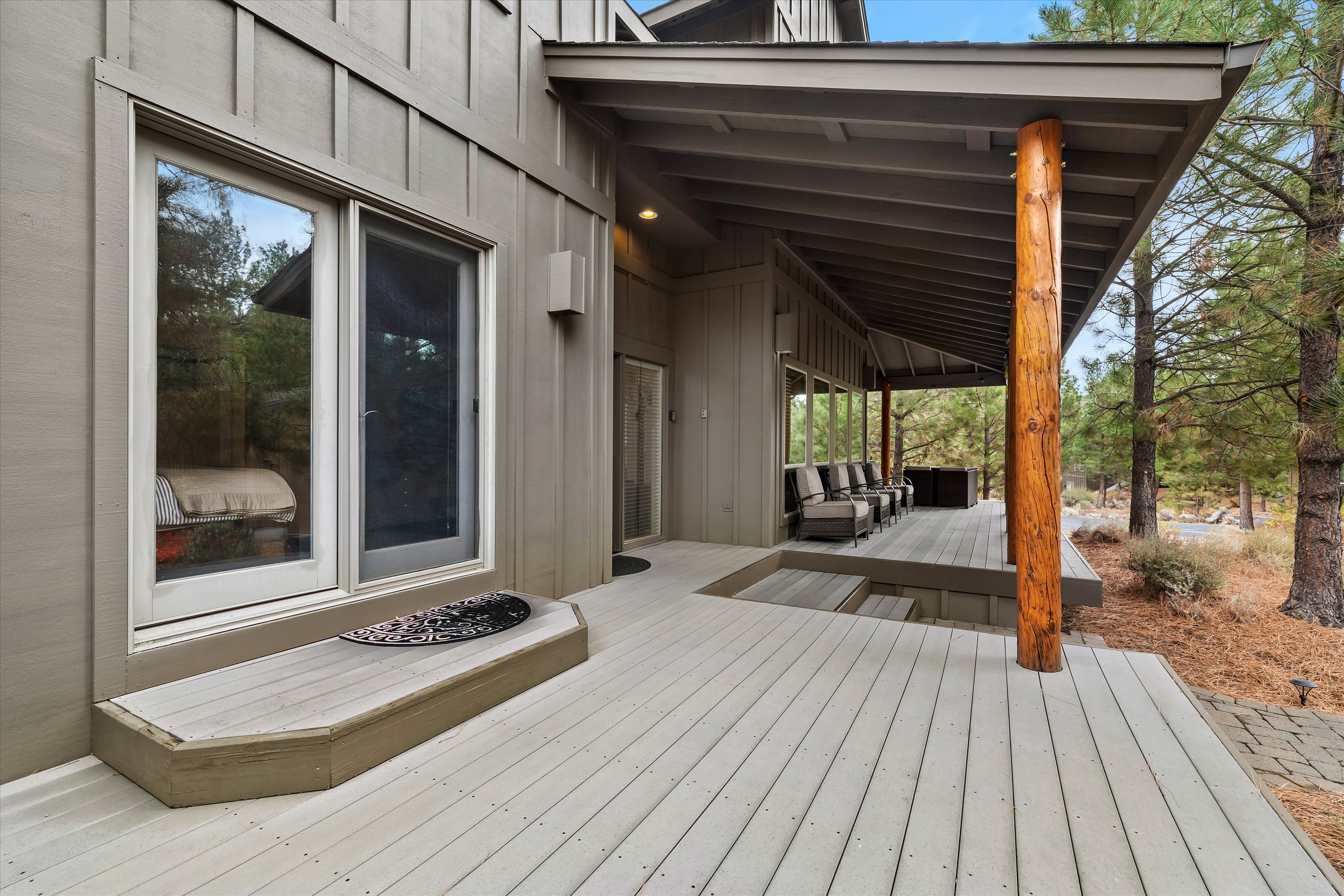 Wrap-around deck with outdoor dining and natural gas grill — Rafters Court, River Wild, Bend OR.