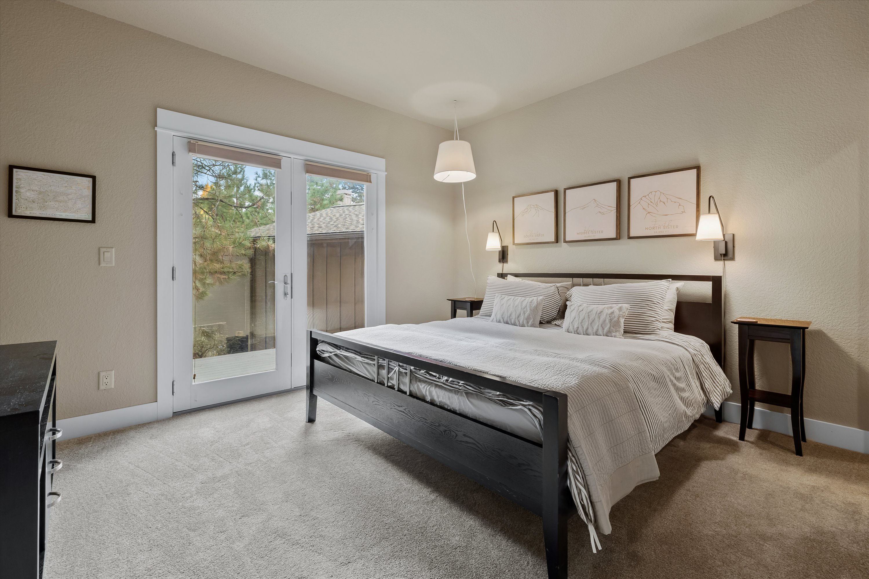 King main suite with private French door deck access.