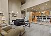 Spacious open-concept living and kitchen area with natural light.