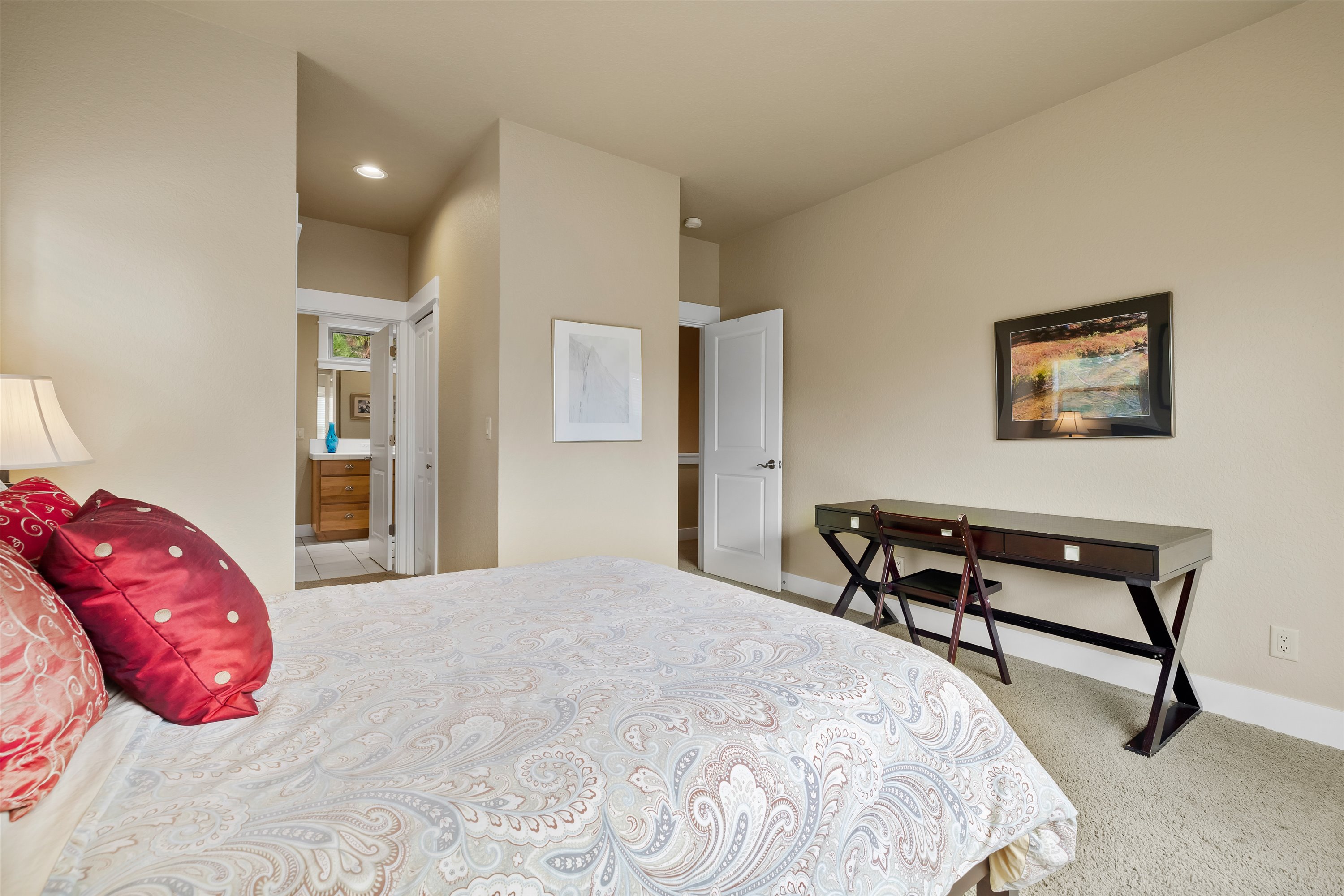Queen guest suite with work desk — ideal for remote workers visiting Bend OR.