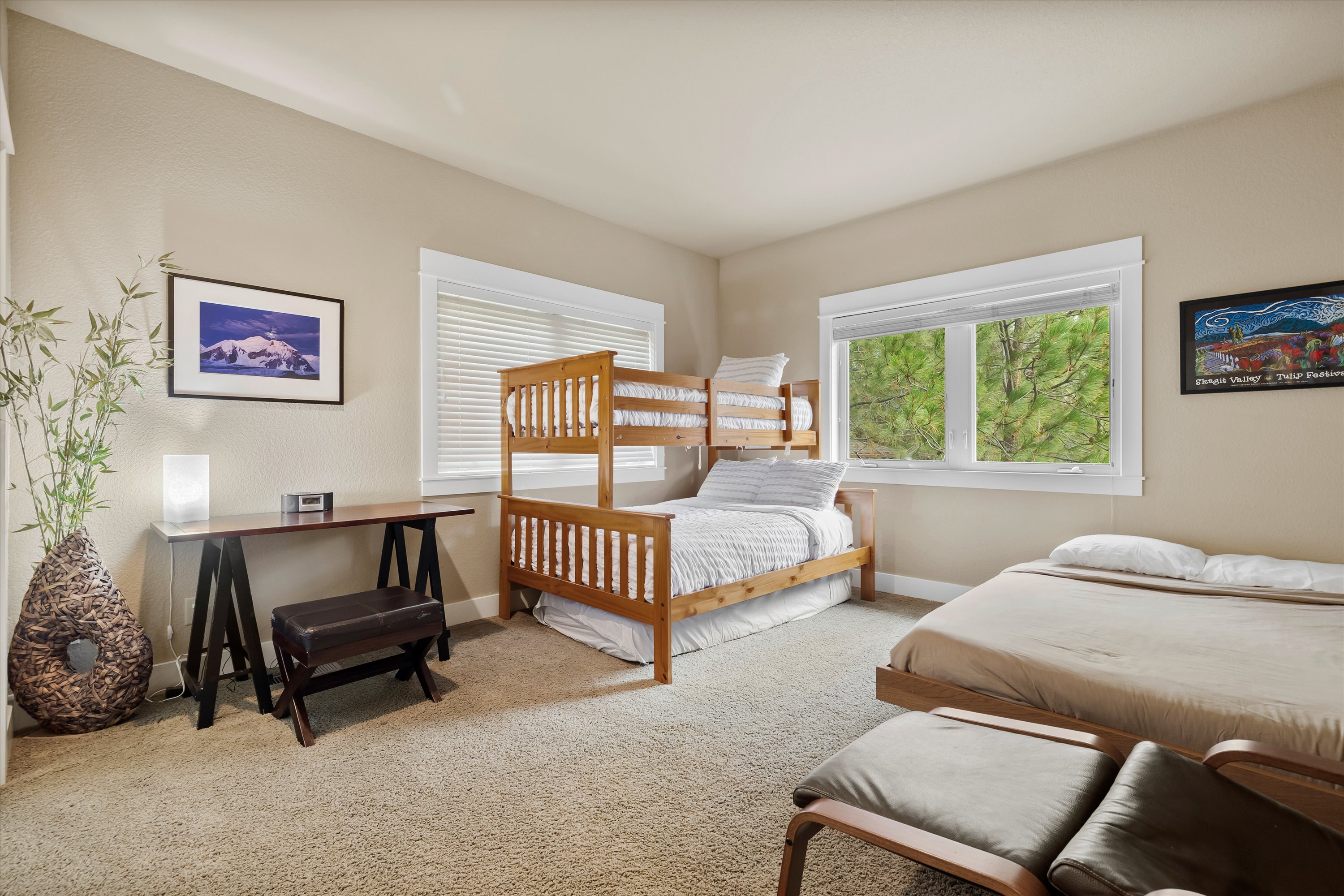 Kids'' bunk room with twin-over-full bunk and extra full bed.