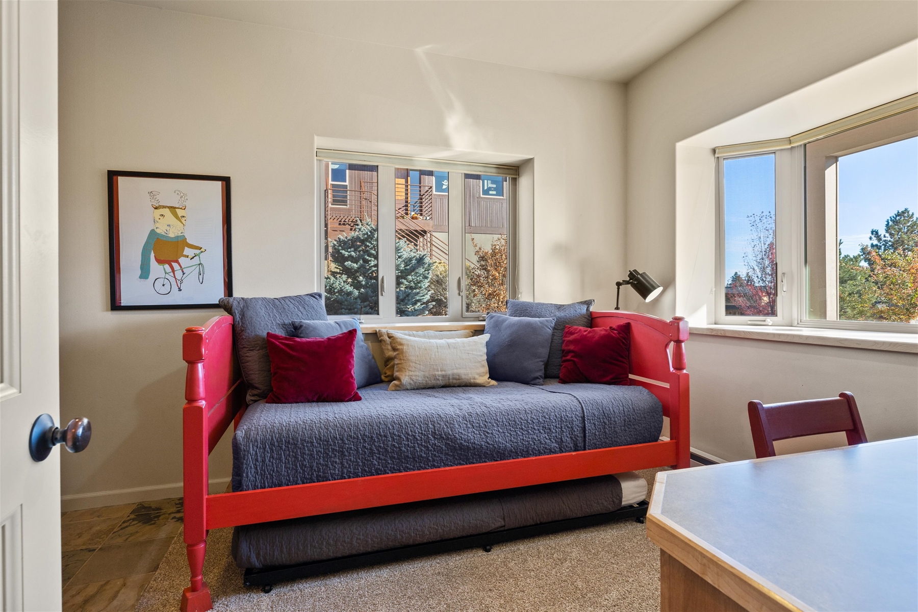 Twin super trundles – two long twin beds, mini fridge, and small TV.