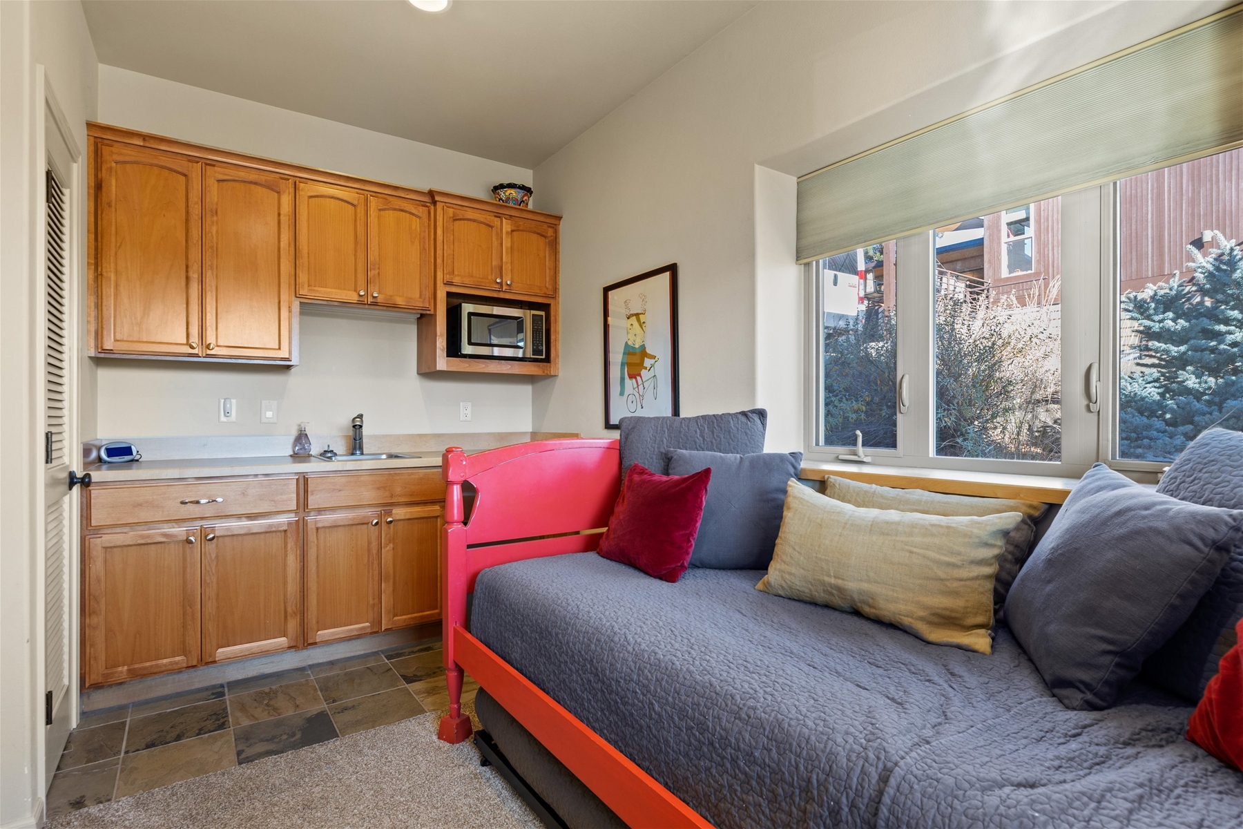 Twin super trundles – two long twin beds, mini fridge, and small TV.
