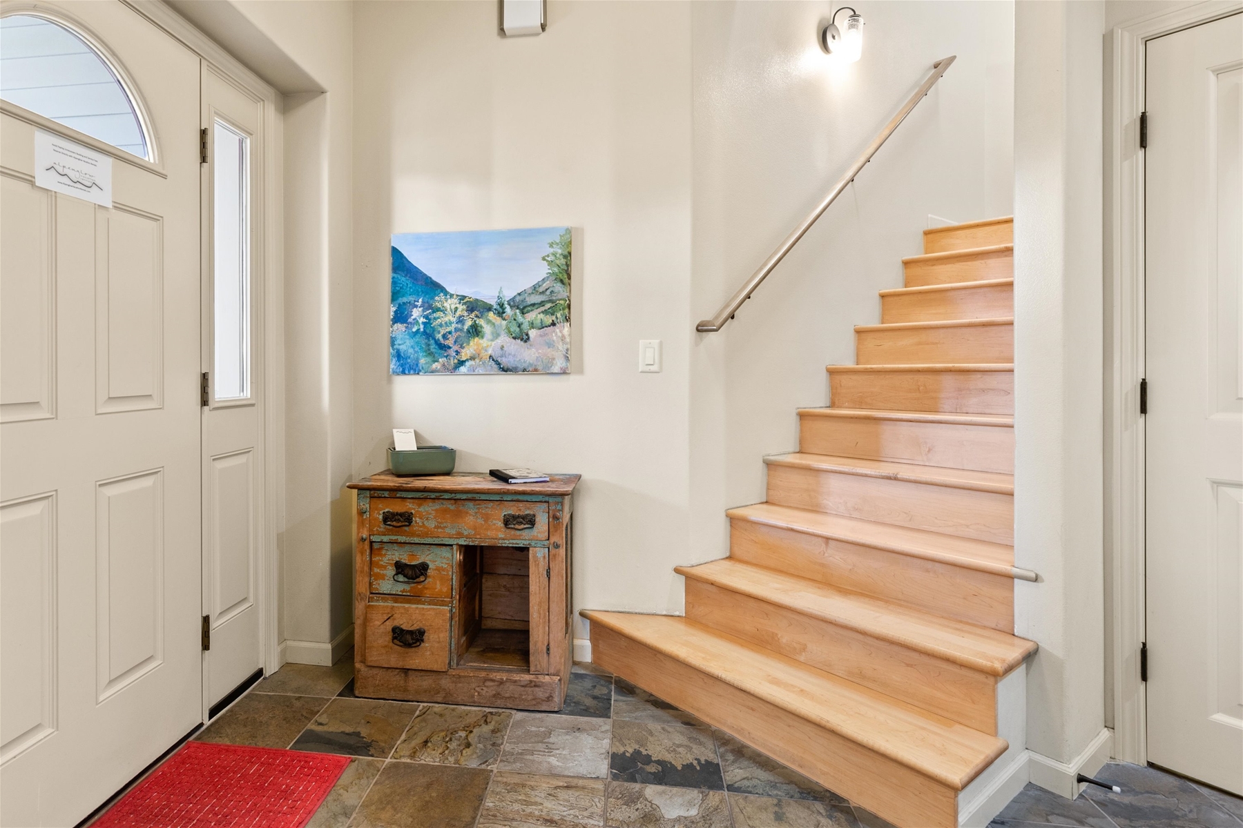 Entryway and stairs to the upper level. 