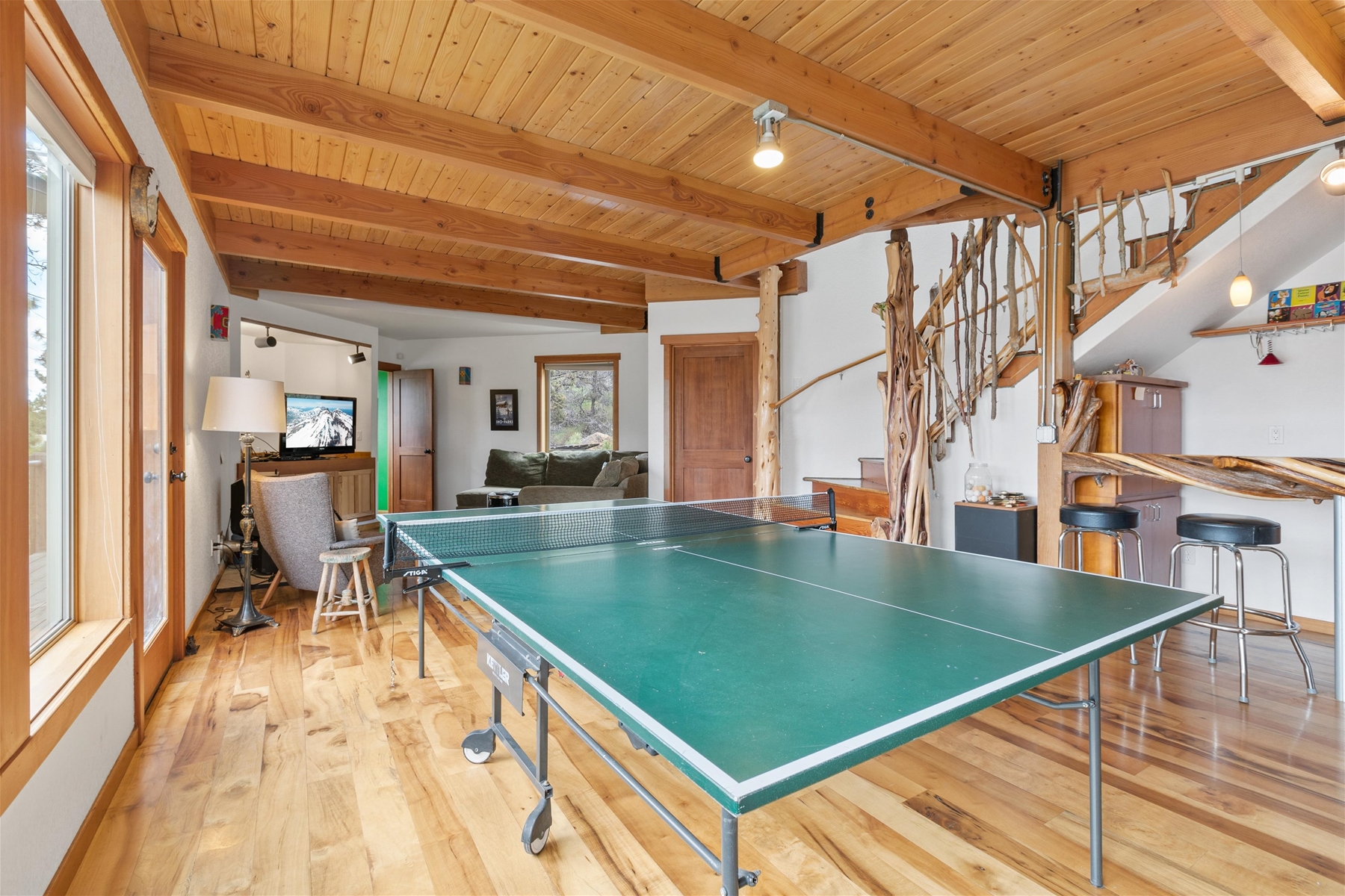 Play ping pong with a view – expansive windows and plenty of sunshine throughout the home. 