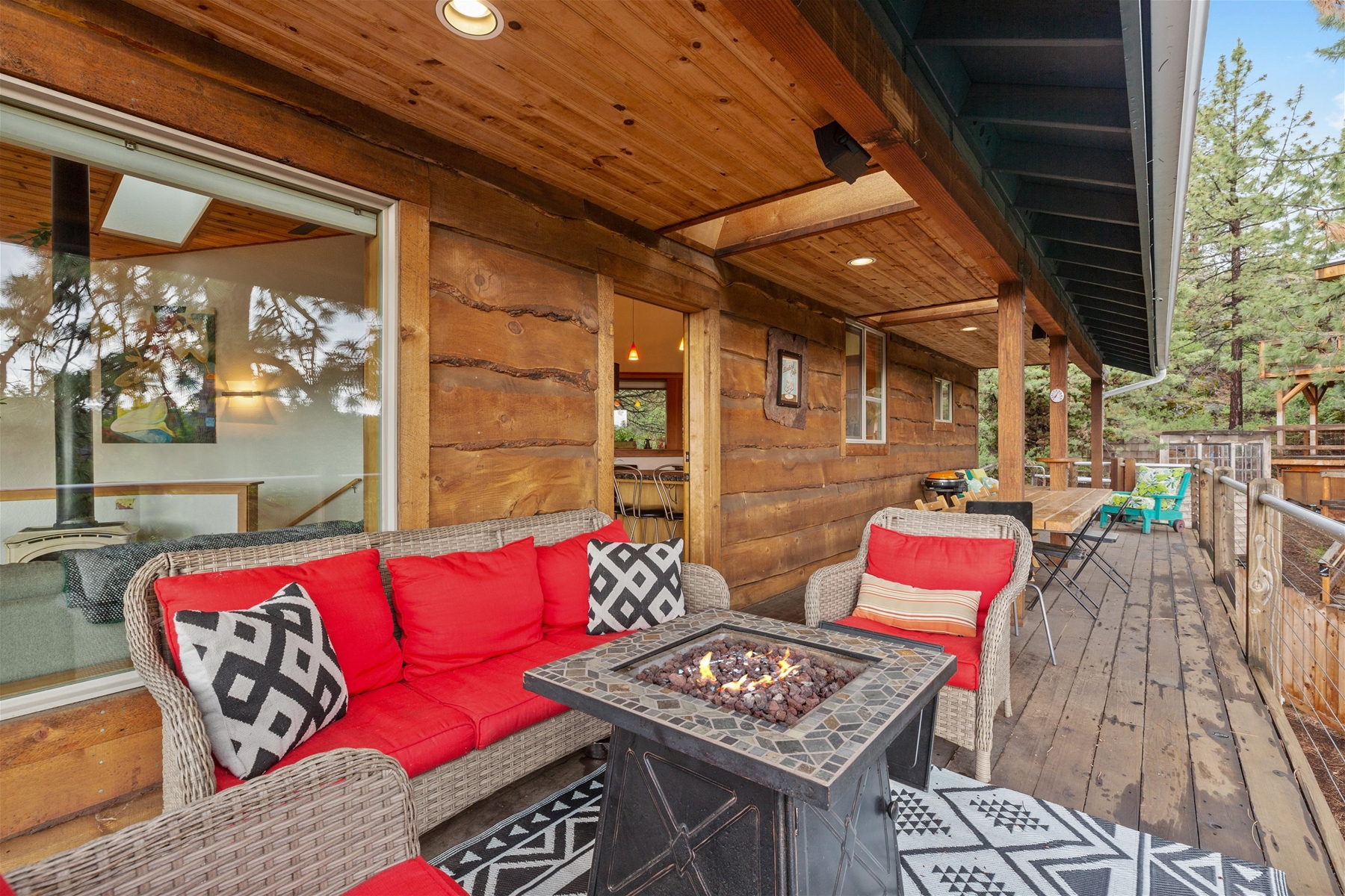 Large wrap around deck with as fire pit and plenty of seating. 
