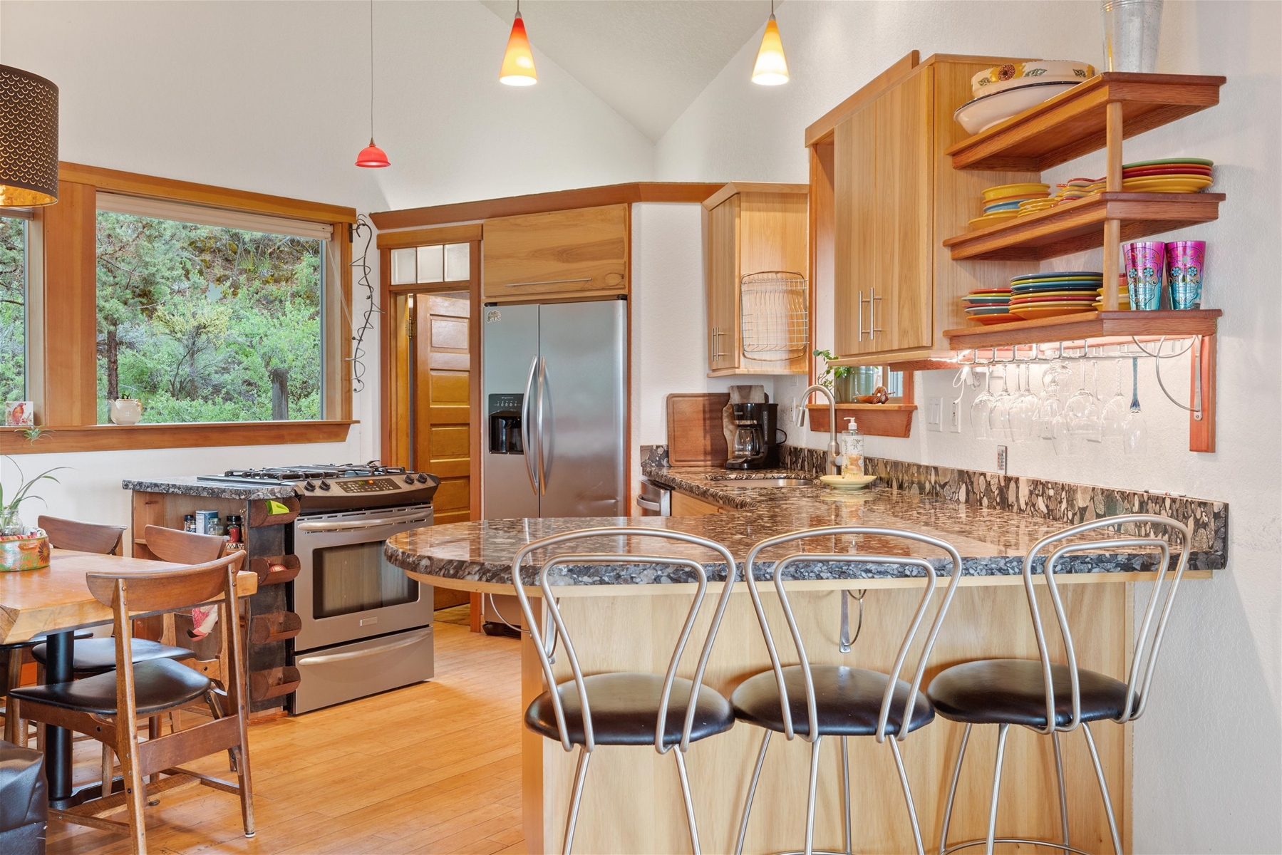 Breakfast bar seating for three and open kitchen concept. 