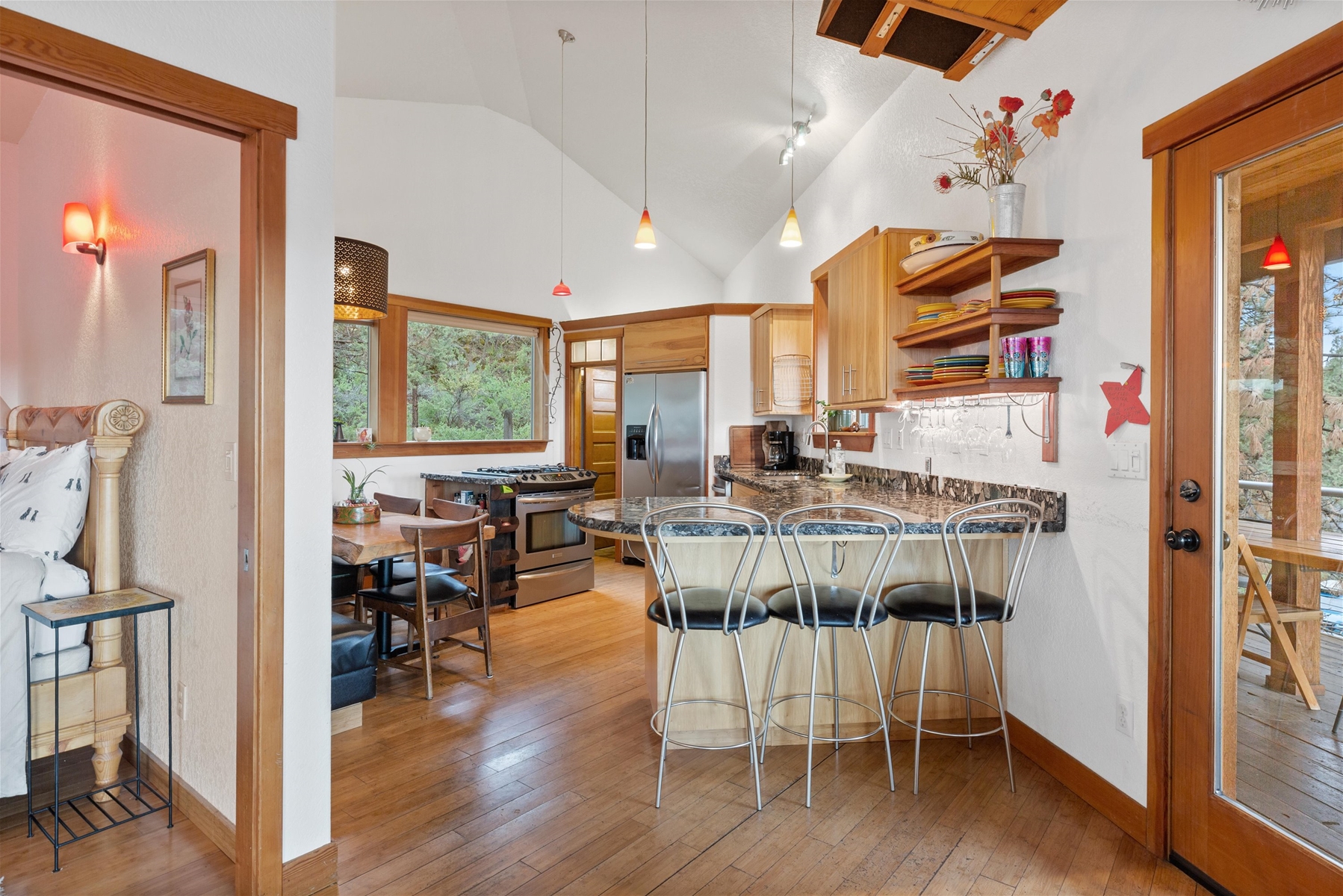 Breakfast bar seating for three and open kitchen concept. 