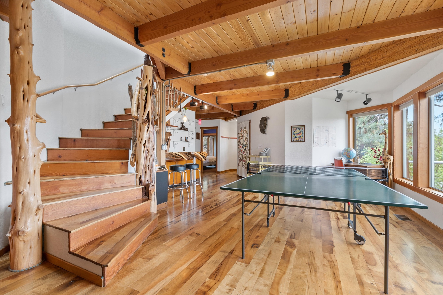 Play ping pong with a view – expansive windows and plenty of sunshine throughout the home. 