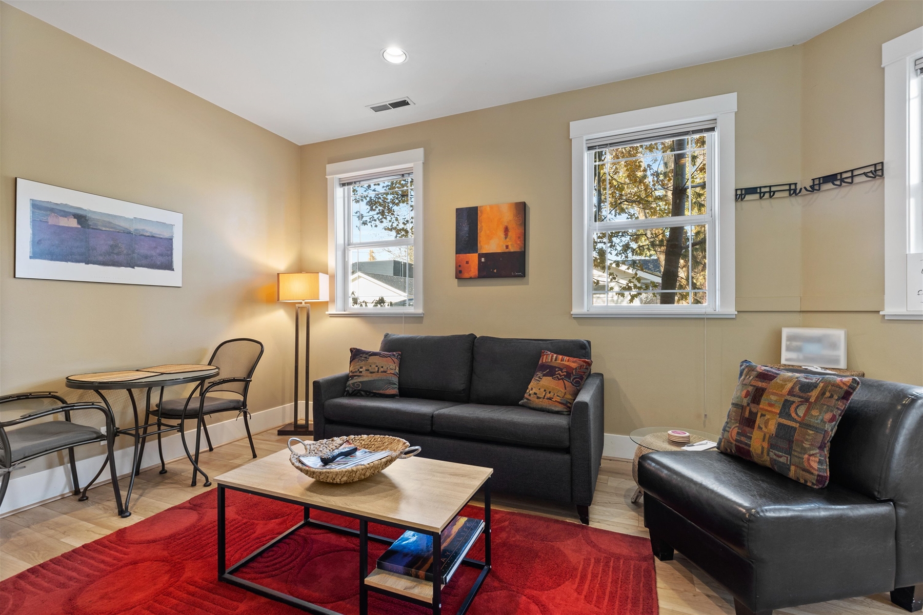 Living room area with smart TV and American Leather Sofa Sleeper.
