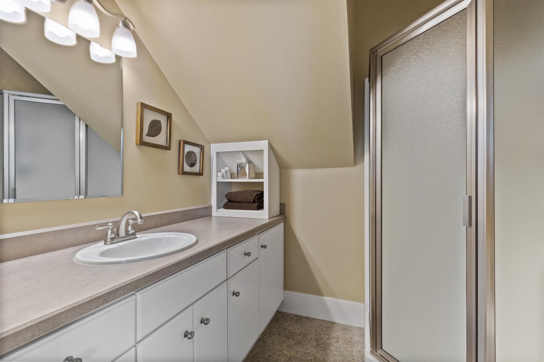 Enjoy the convenience of a walk-in shower in this well-appointed bathroom.