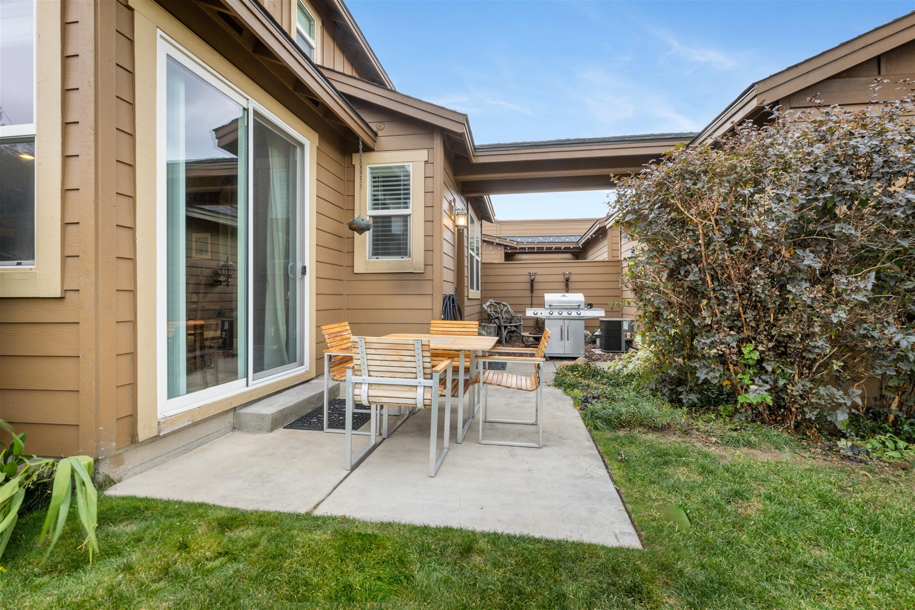 Outdoor patio seating and grill.