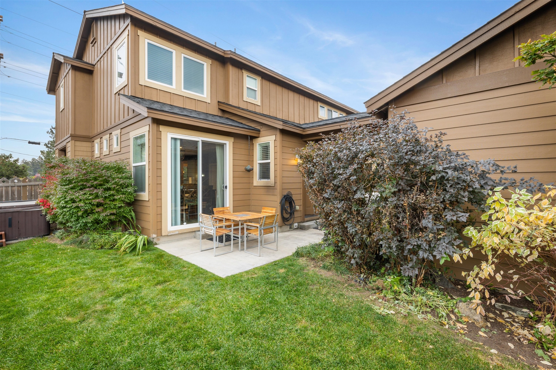 Outdoor patio seating and grill - fully fenced backyard. 