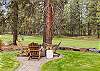 Gather around the gas firepit in the backyard and enjoy golf course views. 