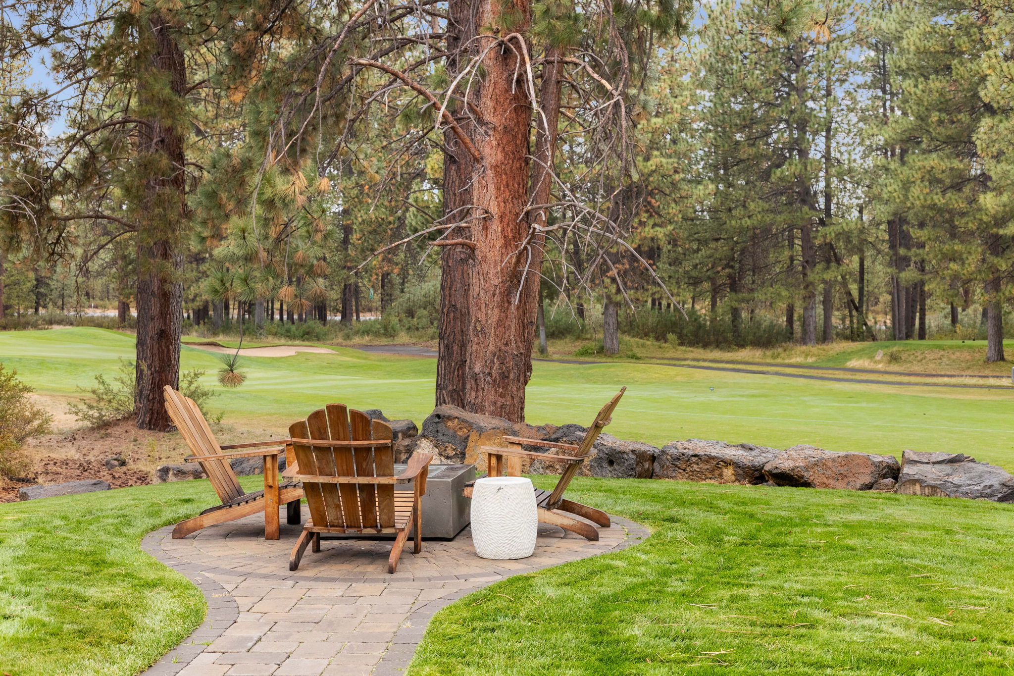 Gather around the gas firepit in the backyard and enjoy golf course views. 