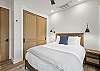 Our second bedroom features a queen bed, mountain views and a Smart TV. 