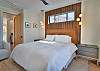 Unwind in this spacious king bedroom with an electric fireplace, Smart TV, and ensuite bathroom. 