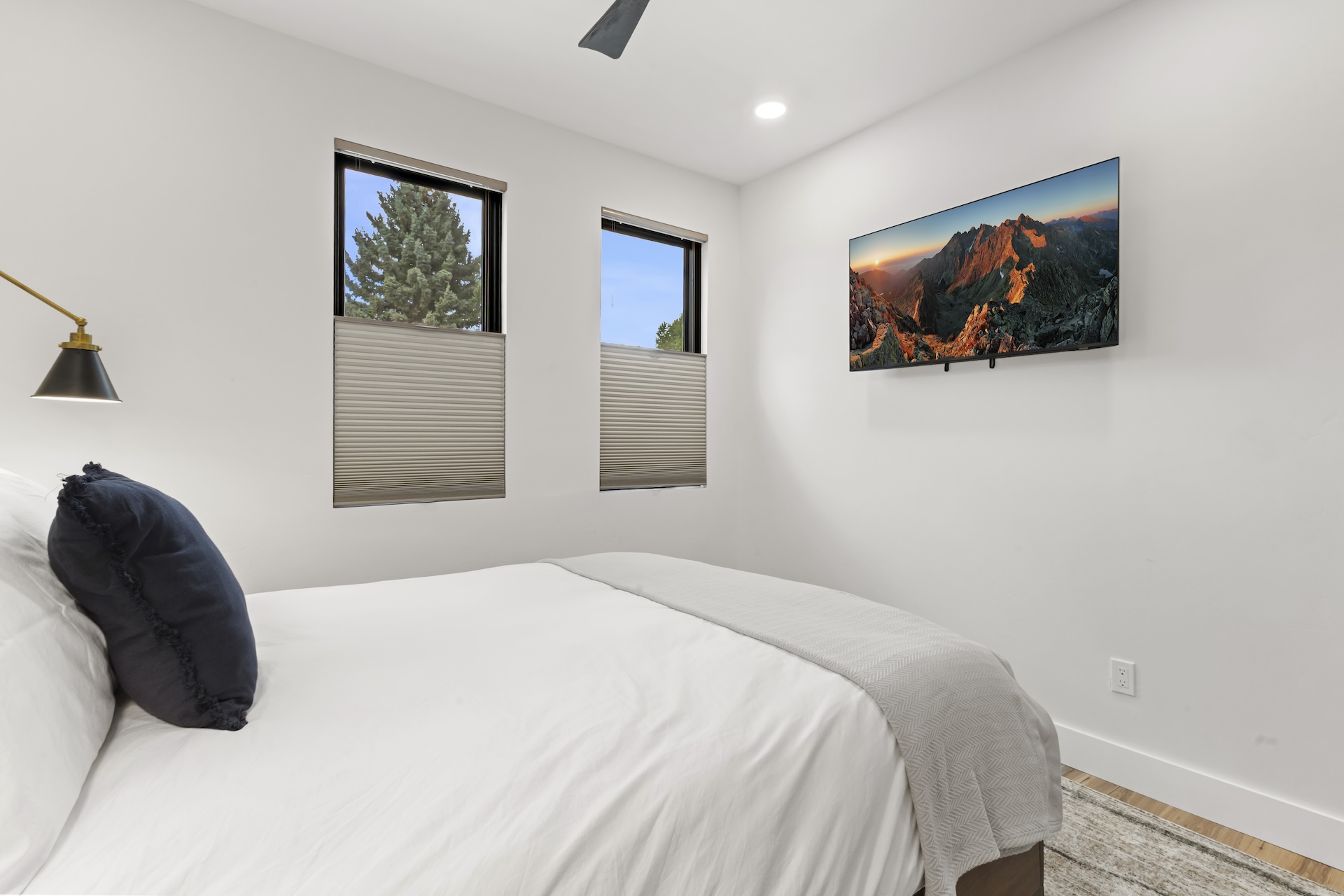 Our second bedroom features a queen bed, mountain views and a Smart TV. 