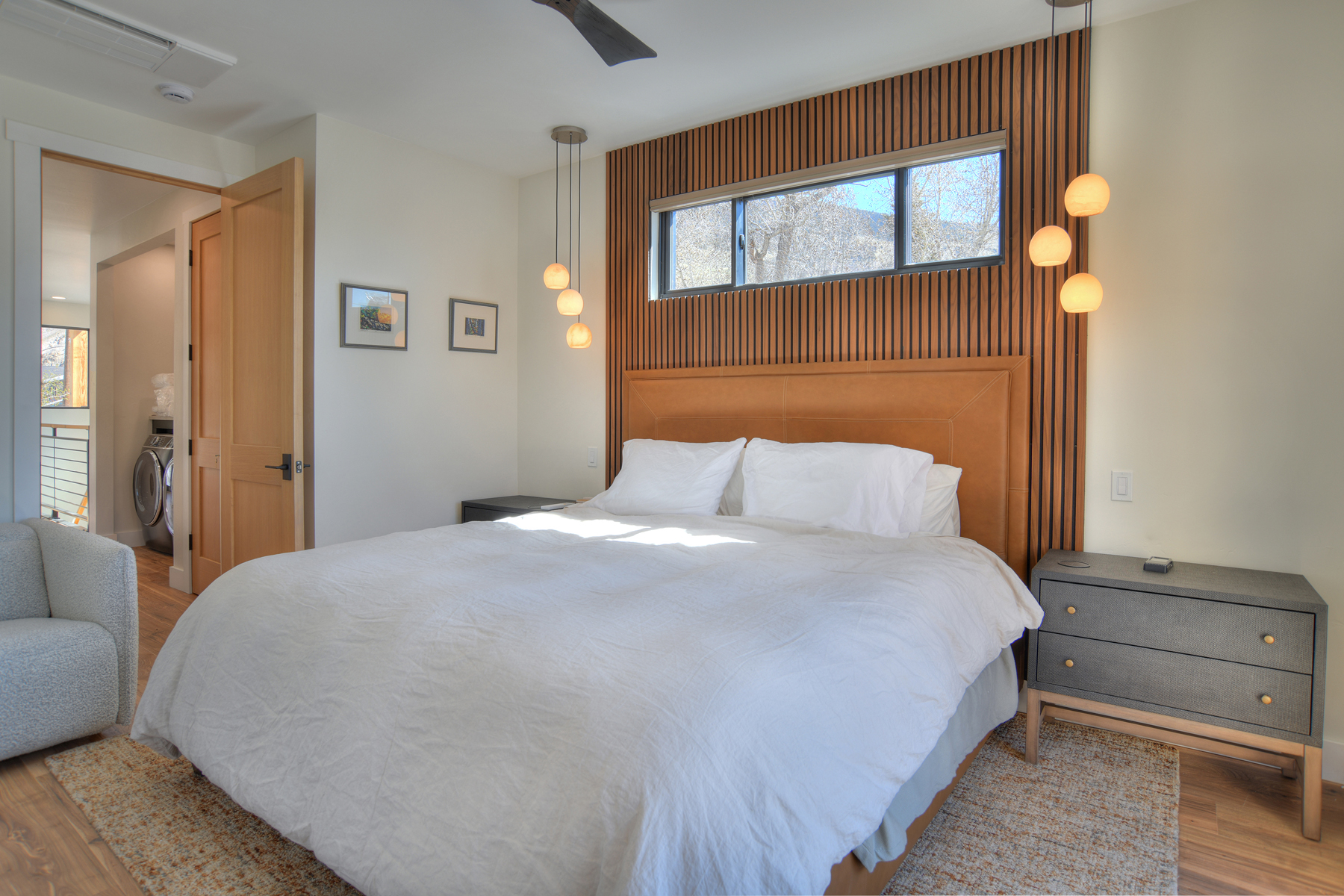 Unwind in this spacious king bedroom with an electric fireplace, Smart TV, and ensuite bathroom. 