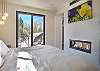 Unwind in this spacious king bedroom with an electric fireplace, Smart TV, and ensuite bathroom. 