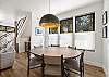 Our large dining table is perfect for gathering around to share a meal or play a game.