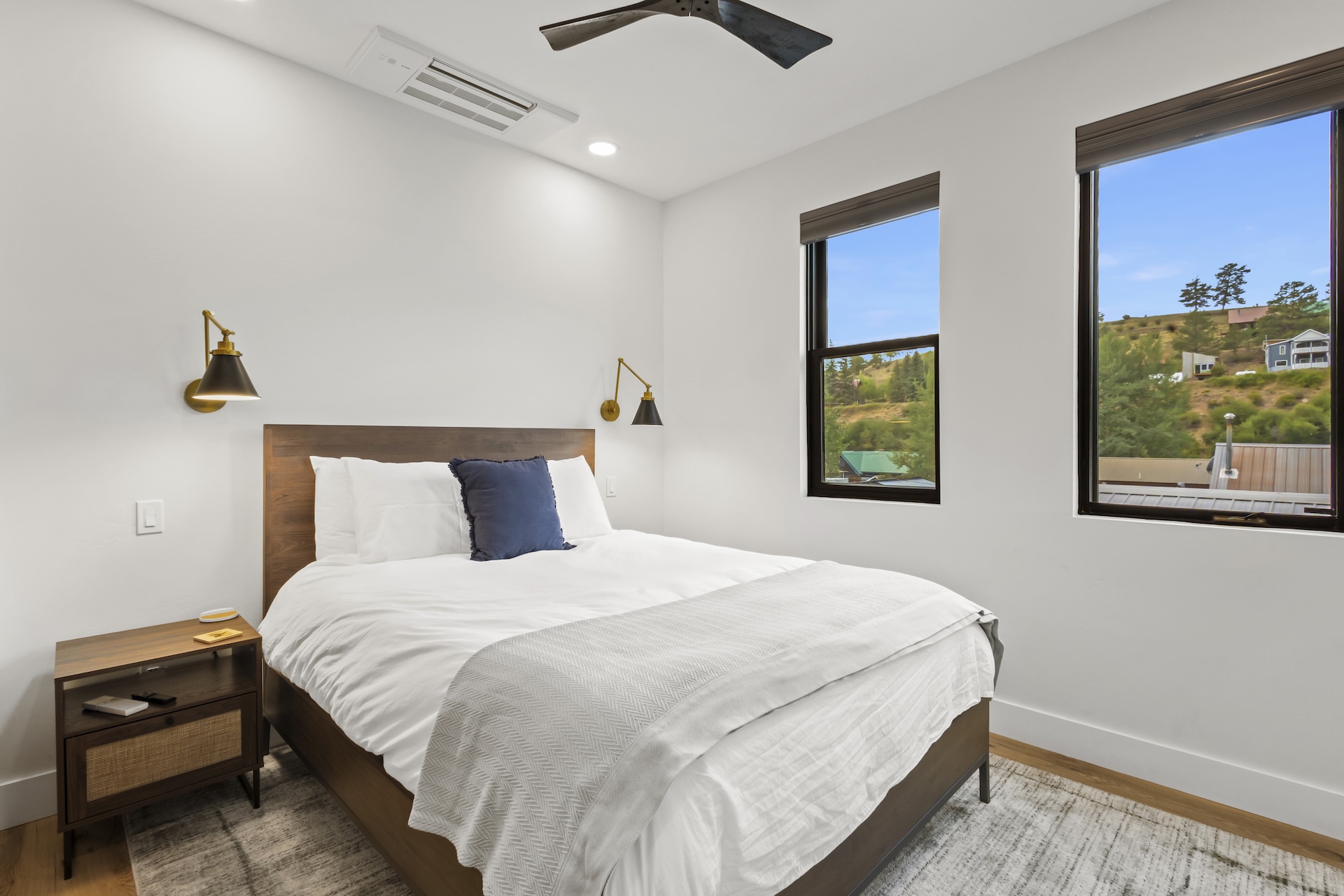 Our second bedroom features a queen bed, mountain views and a Smart TV. 