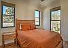 Relax and recharge in this cozy queen bedroom retreat. Beautiful views of the cliffs above Creede are right out the window!