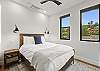 Our second bedroom features a queen bed, mountain views and a Smart TV. 