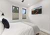Our second bedroom features a queen bed, mountain views and a Smart TV. 