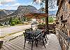 Lower side deck with outdoor dining space for 6 and mountain views.