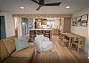 Beautifully designed kitchen and living area with breakfast bar seating for 3 people and dining seating for 4. 
