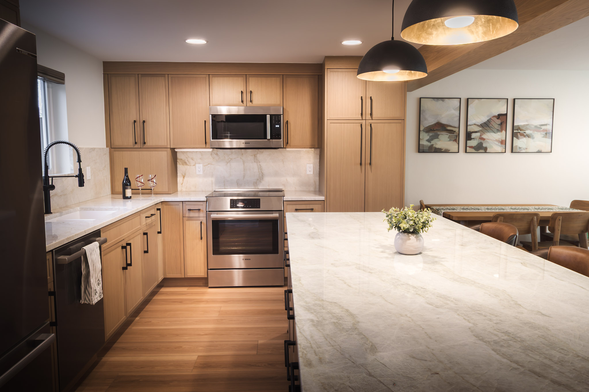 Beautifully designed kitchen and living area with breakfast bar seating for 3 people and dining seating for 4. 