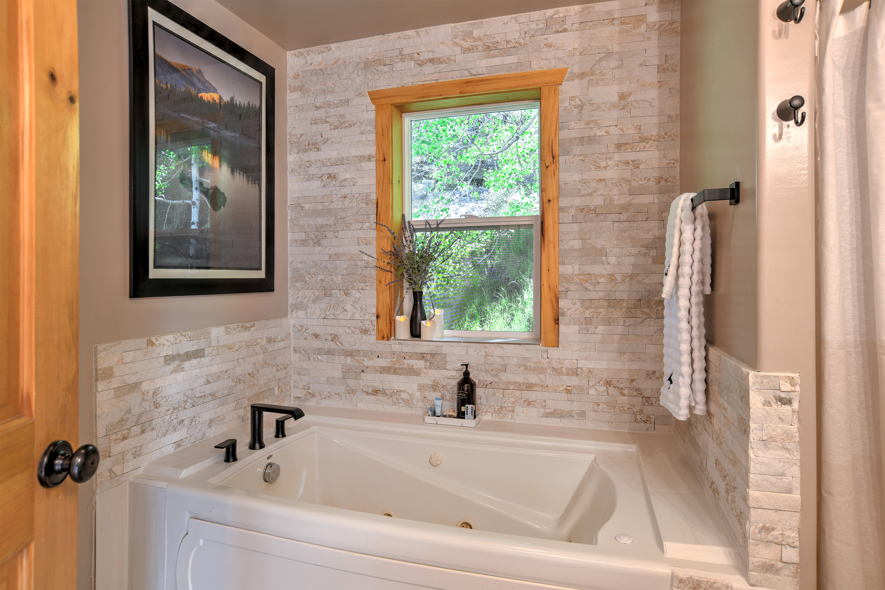 Full bathroom featuring a sleek walk-in shower and tub.