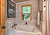 Full bathroom featuring a sleek walk-in shower and tub.